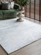 Alchemy Oat White Rug styled in a modern minimalist living room showcasing its versatile neutral tone and plush texture
